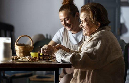 women working on puzzle